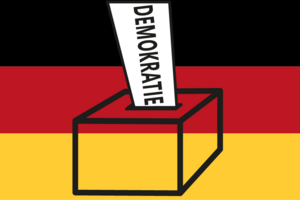 Grafik: Ein Stimmzettel mit der Aufschrift "Demokratie" wird in eine Wahlurne eingesteckt.